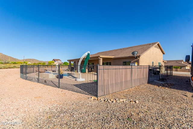 view of home's exterior with a playground