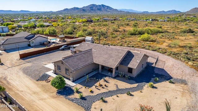 birds eye view of property with a mountain view