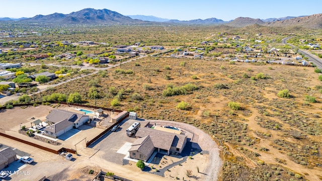 birds eye view of property featuring a mountain view