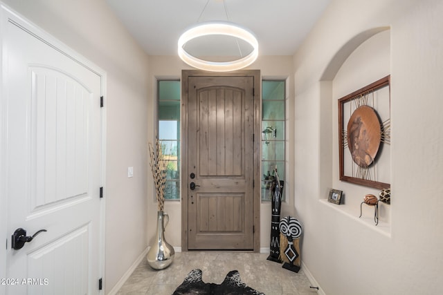 entrance foyer featuring light tile floors