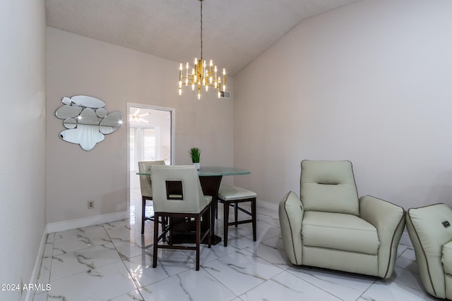 dining room featuring an inviting chandelier, a textured ceiling, and lofted ceiling