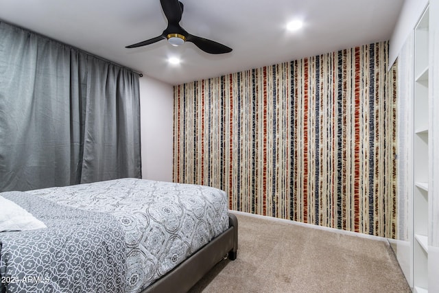 carpeted bedroom with ceiling fan