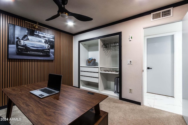 carpeted home office with ornamental molding and ceiling fan