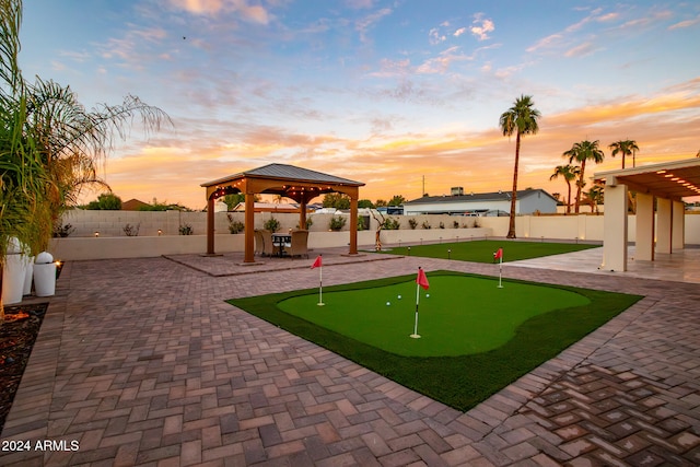 surrounding community with a gazebo and a patio area