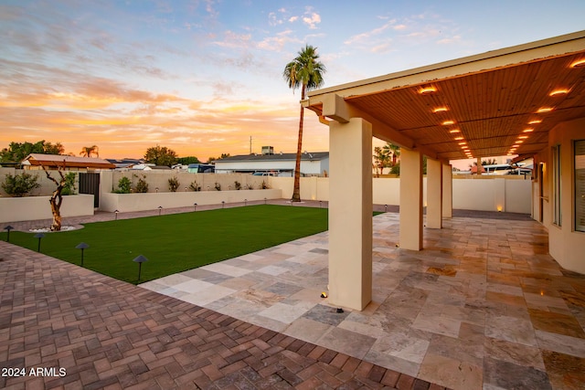 patio terrace at dusk with a yard