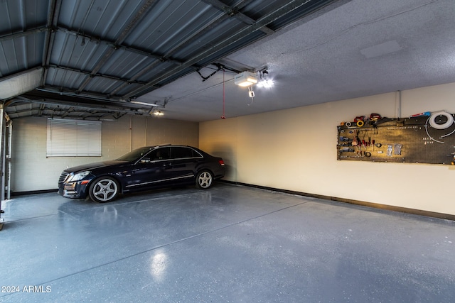 garage featuring a garage door opener