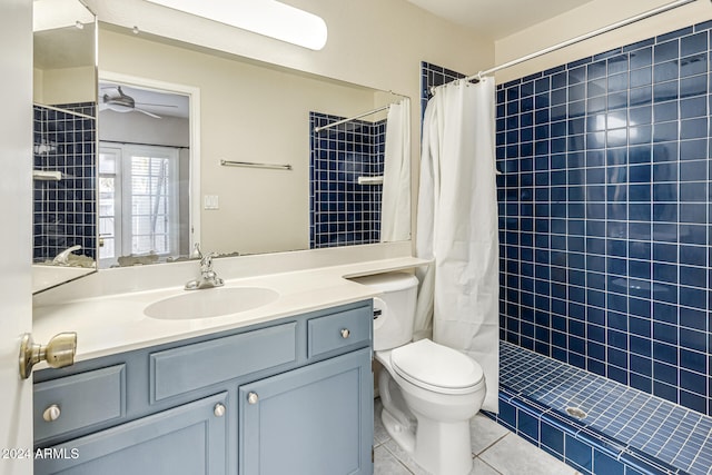 bathroom with vanity, tile patterned flooring, curtained shower, toilet, and ceiling fan