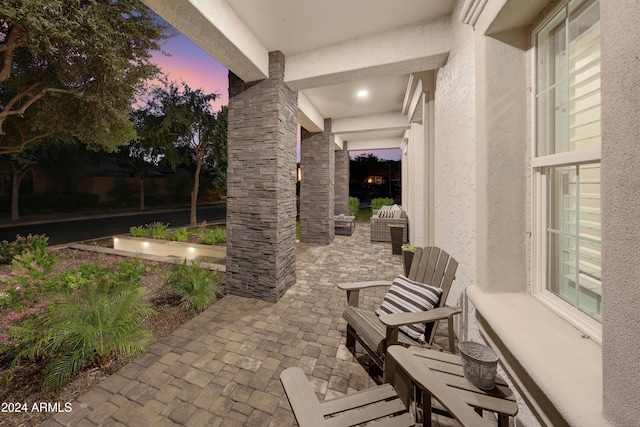 view of patio terrace at dusk