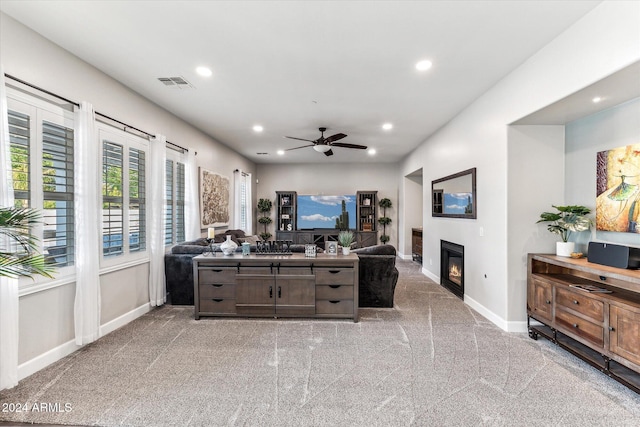 living room with light carpet and ceiling fan