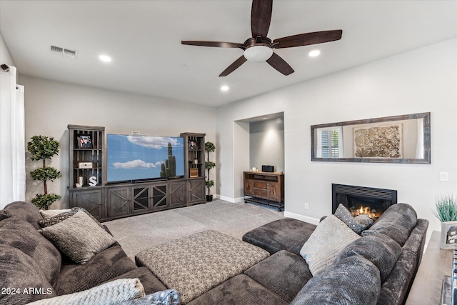 living room with light carpet and ceiling fan