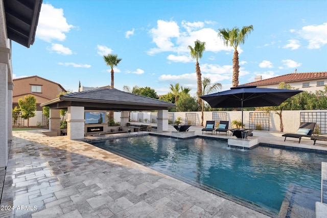 view of swimming pool with a gazebo and a patio area