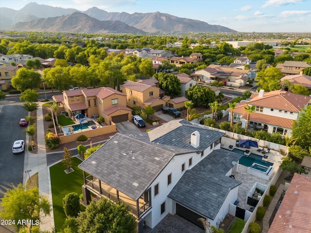 birds eye view of property featuring a mountain view