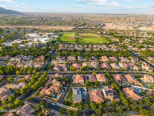 birds eye view of property with a mountain view