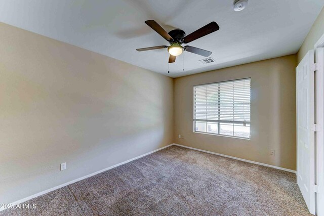 10524 W Pima St, Tolleson, AZ 85353 - empty room with carpet, a smoke detector, and a ceiling fan