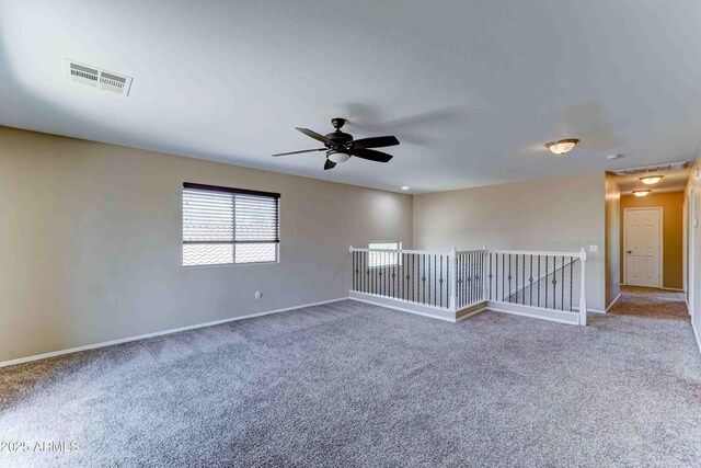 10524 W Pima St, Tolleson, AZ 85353 - carpeted spare room with a ceiling fan and baseboards