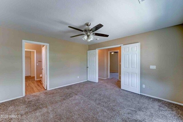 10524 W Pima St, Tolleson, AZ 85353 - unfurnished bedroom featuring carpet floors, a ceiling fan, and ensuite bath