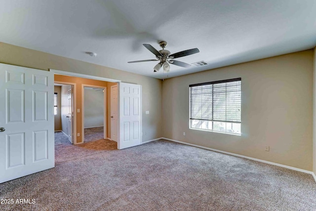10524 W Pima St, Tolleson, AZ 85353 - unfurnished bedroom featuring carpet floors and a ceiling fan