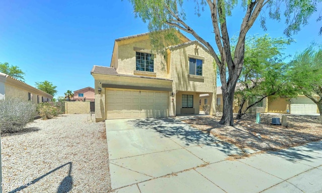 10524 W Pima St, Tolleson, AZ 85353 - traditional-style house with stucco siding, a garage, and driveway