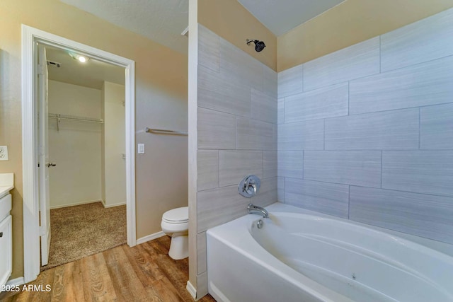 10524 W Pima St, Tolleson, AZ 85353 - full bathroom with wood finished floors, vanity, and a spacious closet