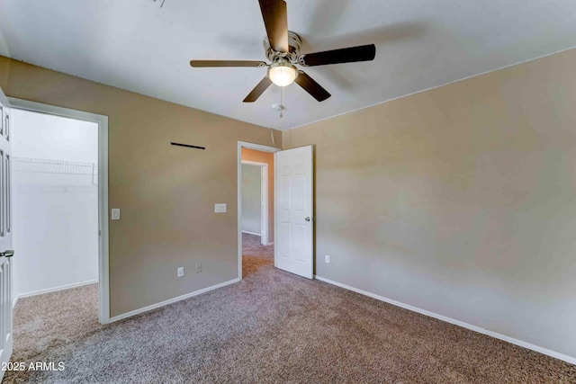 10524 W Pima St, Tolleson, AZ 85353 - unfurnished bedroom featuring carpet floors, a walk in closet, ceiling fan, and a closet