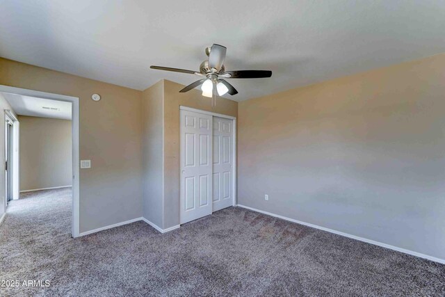 10524 W Pima St, Tolleson, AZ 85353 - unfurnished bedroom featuring carpet floors, a closet, and ceiling fan