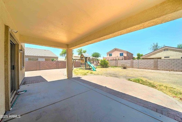 10524 W Pima St, Tolleson, AZ 85353 - fenced backyard featuring a playground and a patio