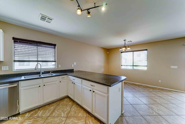 10524 W Pima St, Tolleson, AZ 85353 - kitchen featuring dishwasher, light tile patterned floors, a peninsula, and white cabinets