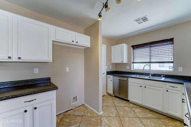10524 W Pima St, Tolleson, AZ 85353 - kitchen featuring stainless steel dishwasher, white cabinets, dark countertops, and light tile patterned floors