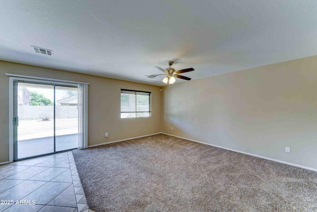 10524 W Pima St, Tolleson, AZ 85353 - unfurnished room with ceiling fan, light carpet, and light tile patterned floors