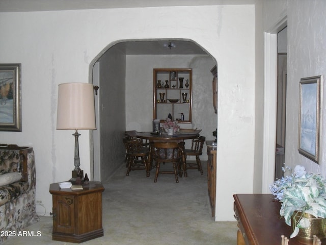 dining room featuring light carpet