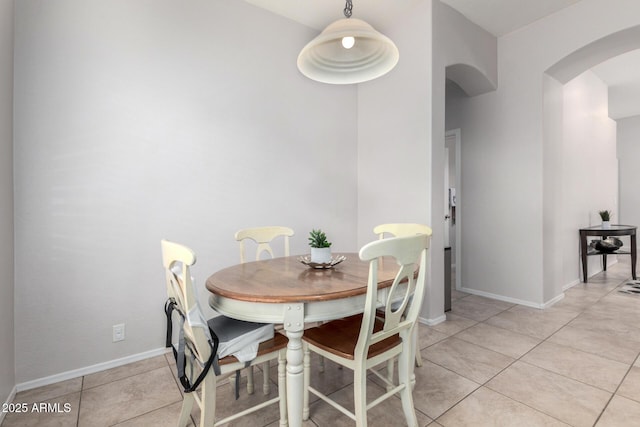 dining space featuring light tile patterned floors