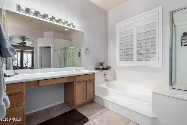 bathroom with ceiling fan, vanity, shower with separate bathtub, and tile patterned flooring