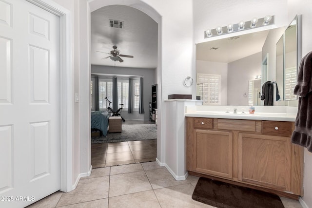 bathroom featuring ceiling fan, tile patterned floors, and vanity