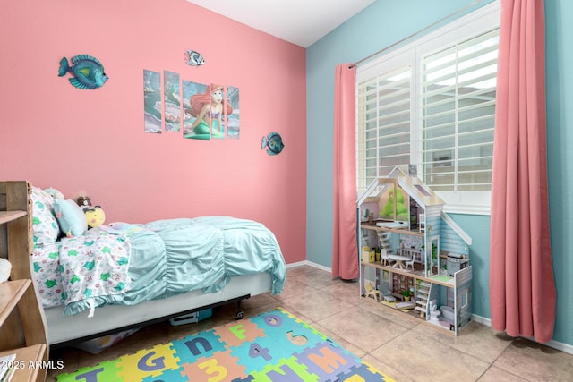 bedroom featuring light tile patterned flooring