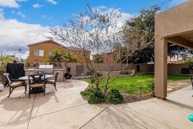 view of patio / terrace featuring area for grilling and a grill