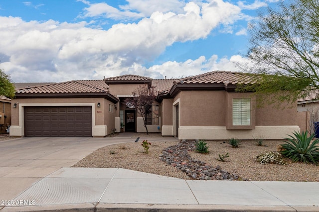 mediterranean / spanish-style home featuring a garage