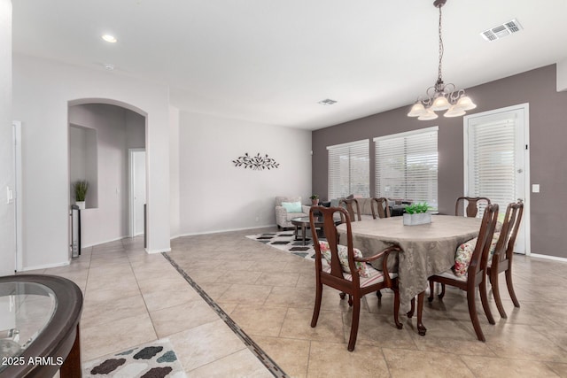 dining area featuring a chandelier