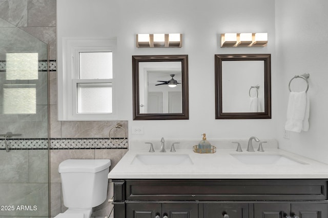 6201 E Waltann Ln, Scottsdale, AZ 85254 - bathroom with double vanity, a tile shower, and a ceiling fan