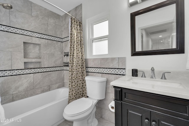 6201 E Waltann Ln, Scottsdale, AZ 85254 - full bathroom with vanity, tile walls, shower / tub combo, and wainscoting