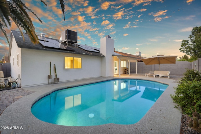 6201 E Waltann Ln, Scottsdale, AZ 85254 - pool at dusk with a patio and a fenced backyard