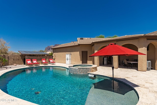 5271 E 10th Ave, Apache Junction, AZ 85119 - view of swimming pool featuring a patio, a pool with connected hot tub, and outdoor dining space
