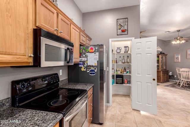 5271 E 10th Ave, Apache Junction, AZ 85119 - kitchen with stainless steel microwave, electric range, light tile patterned floors, ceiling fan, and dark stone countertops