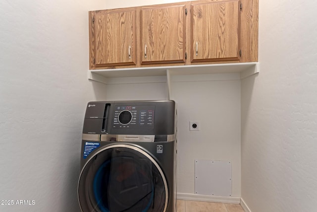 5271 E 10th Ave, Apache Junction, AZ 85119 - washroom featuring washer / clothes dryer, cabinet space, and light tile patterned flooring