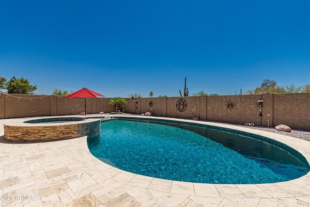 5271 E 10th Ave, Apache Junction, AZ 85119 - view of pool featuring a fenced backyard, a pool with connected hot tub, and a patio
