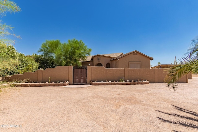 5271 E 10th Ave, Apache Junction, AZ 85119 - view of front of house with a gate and stucco siding
