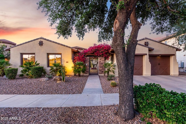 816 W Sycamore Ct, Litchfield Park, AZ 85340 - view of front of home with a garage, stucco siding, driveway, and a tiled roof