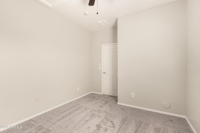 unfurnished bedroom with carpet, visible vents, baseboards, and a ceiling fan