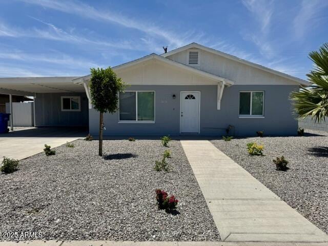 2634 N 52nd Ave, Phoenix, AZ 85035 - view of front of house with a carport and concrete driveway