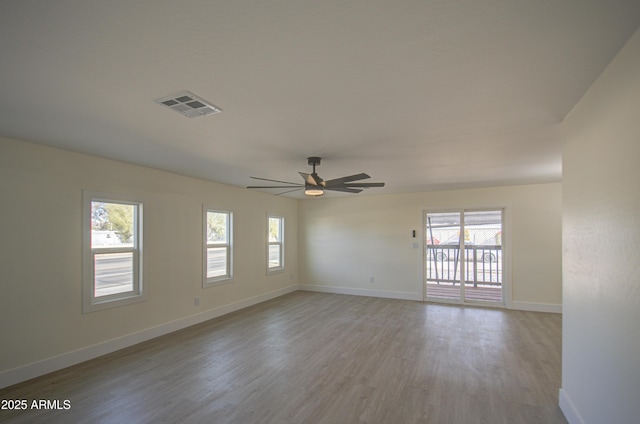 unfurnished room with ceiling fan and light hardwood / wood-style flooring