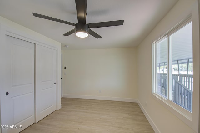 unfurnished bedroom featuring a closet, ceiling fan, and light hardwood / wood-style flooring